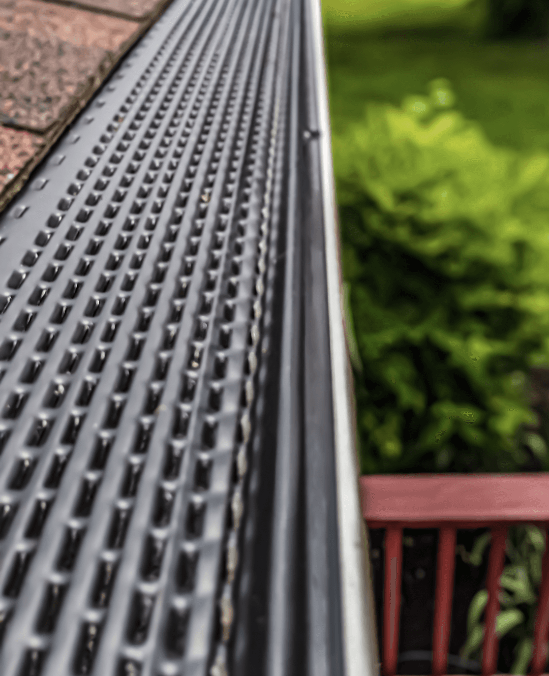 Close-up of gutter guard protection installed along a roofline